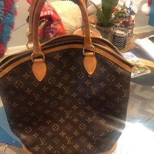 Authentic Louis Vuitton lock it bag